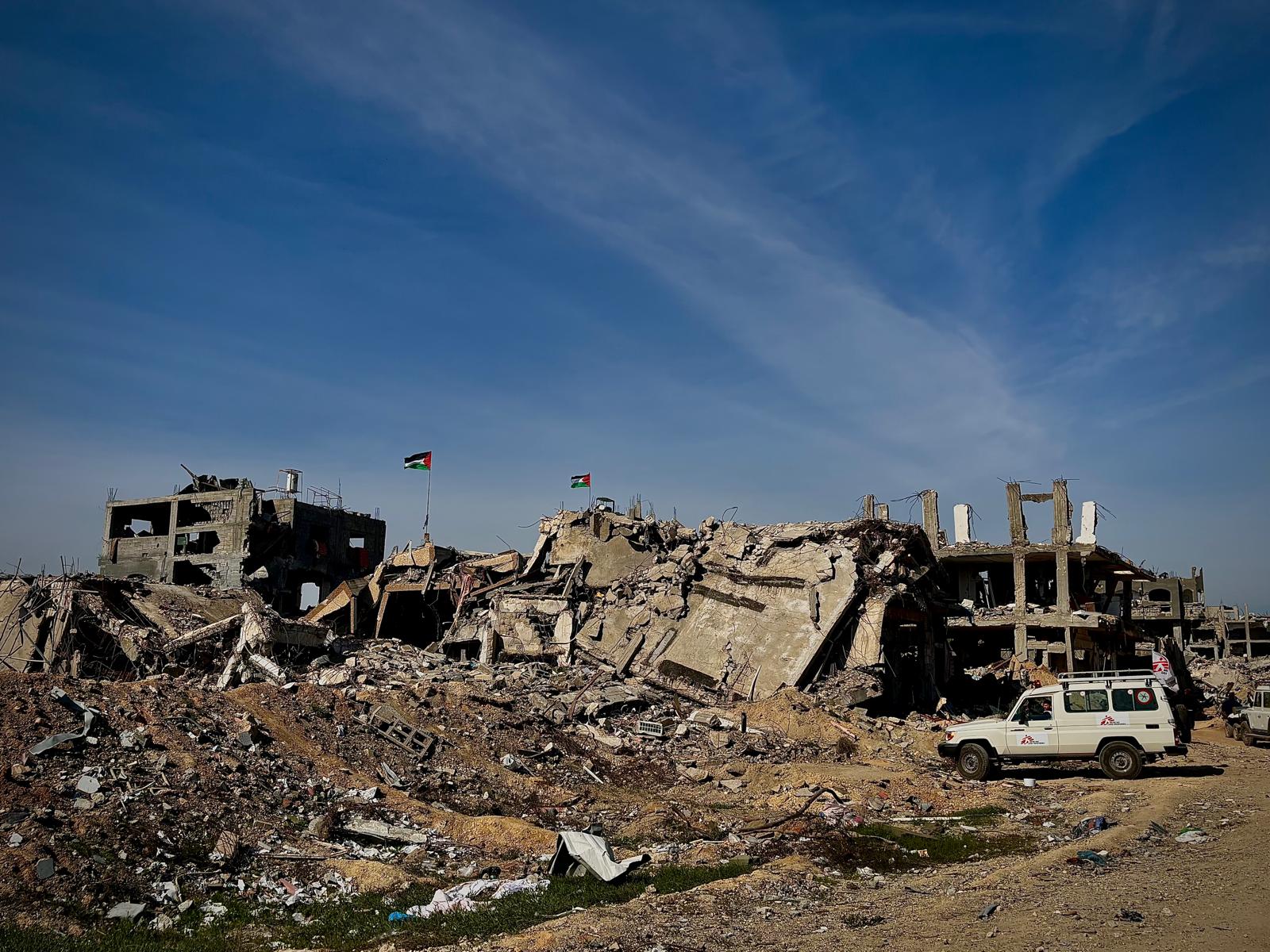 An MSF vehicle is parked next to ruined buildings in Beit Hanoun - Palestinian Territories